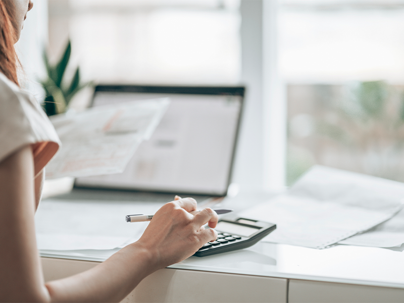 person reviewing and consolidating bills